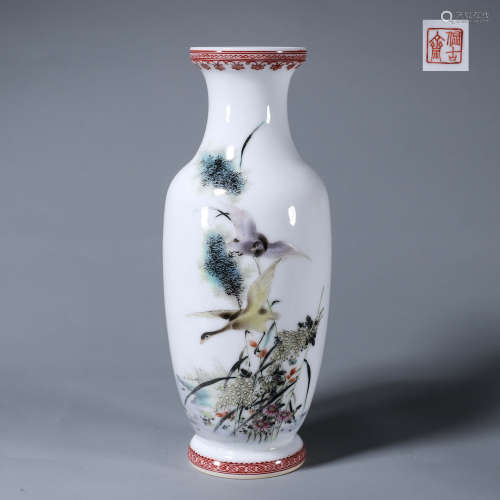 A light colored bird and flower porcelain vase