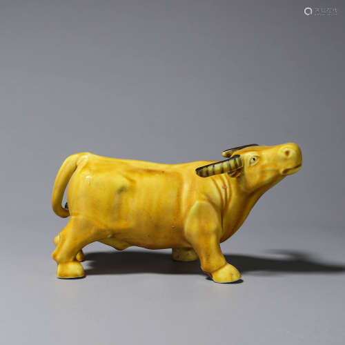 A yellow glazed porcelain ox ornament
