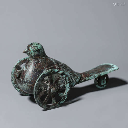 A bird-shaped bronze cart