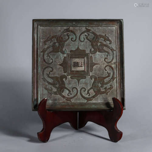 A squared beast patterned bronze mirror