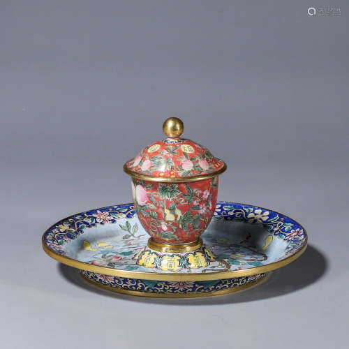 A copper enamel cup and saucer