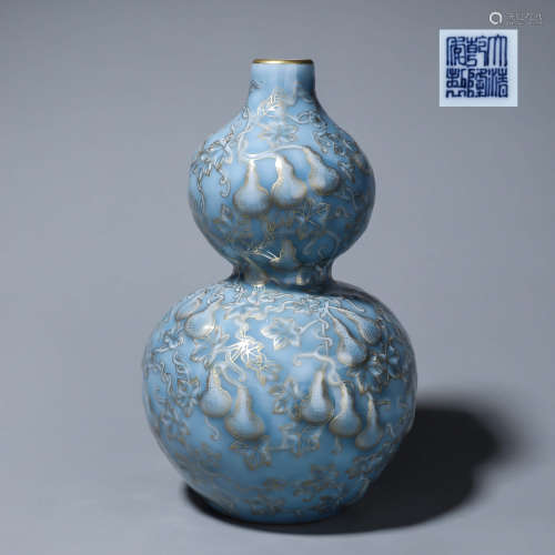 A gilt celeste glazed porcelain gourd-shaped vase