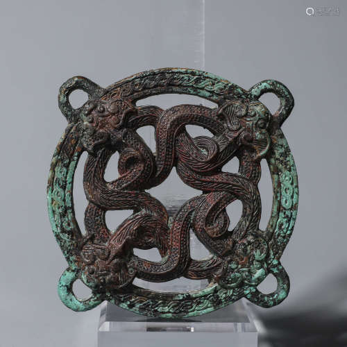 A bronze dragon pendant
