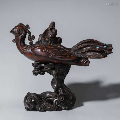 An aloeswood carved figure and phoenix ornament with red san...