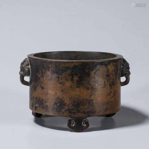 A round copper censer with lion head shaped ears