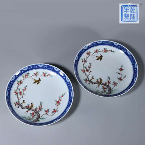 A pair of blue and white famille rose magpie and plum blosso...