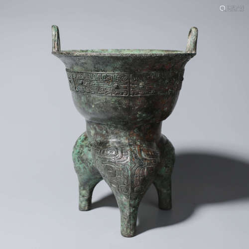 A taotie patterned bronze double-eared vessel