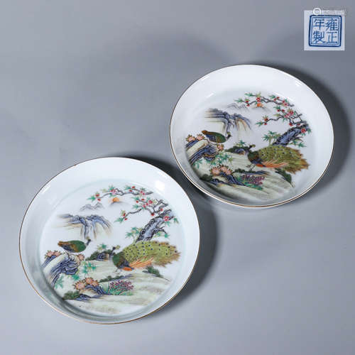 A pair of famille rose peacock porcelain plates