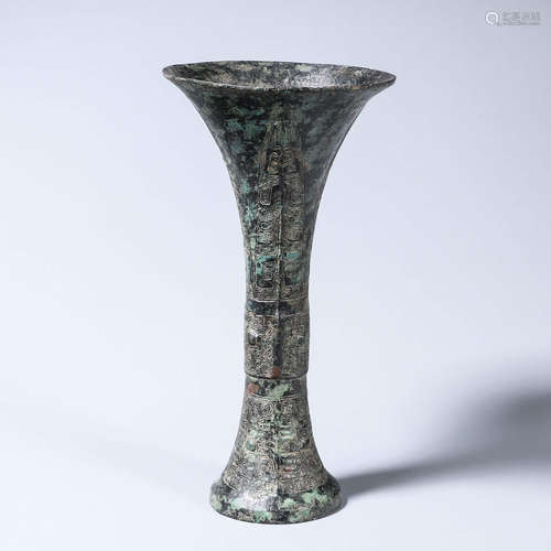 A taotie patterned bronze beaker vase