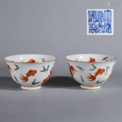 A pair of gilt iron red koi porcelain bowls