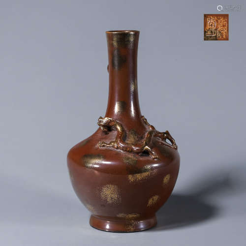 A red glazed gold sprinkled dragon porcelain vase