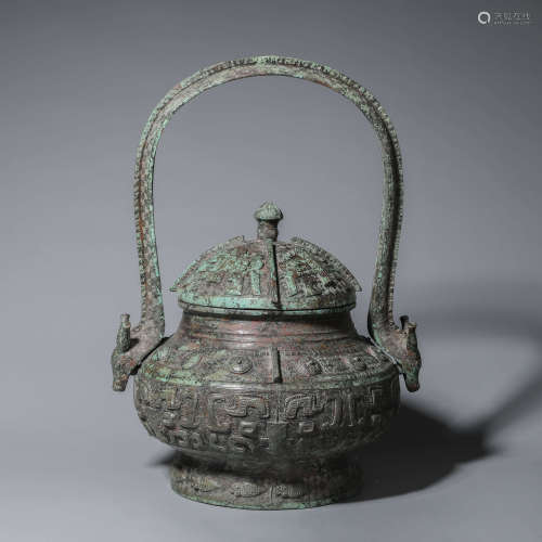 A taotie patterned loop-handled bronze pot