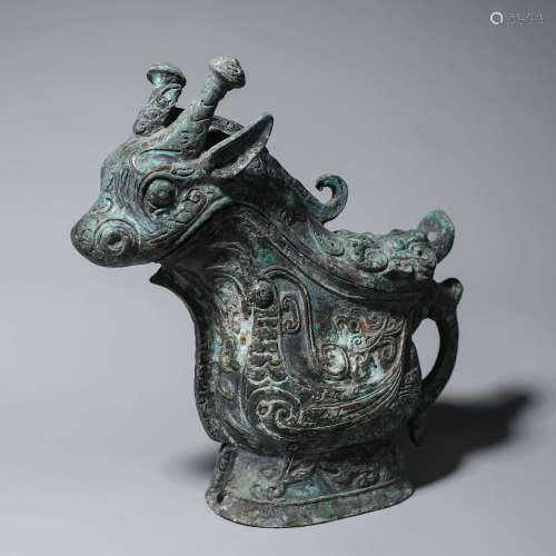 A taotie patterned goat shaped bronze pot