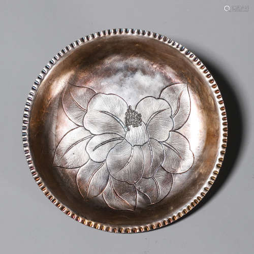 A flower patterned silver plate