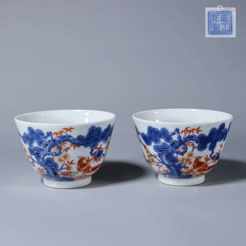 A pair of blue and white iron red porcelain cups