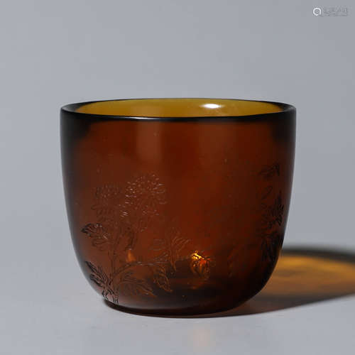 A flower inscribed glass cup