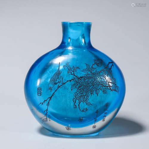 An inscribed glass flask