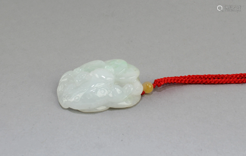 A Carved Jade Pendant with necklace