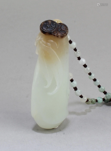 A Carved Jade Pendant with necklace