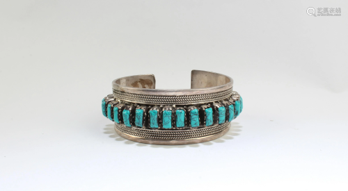 A silver Bangle, handmade and hand beaded with