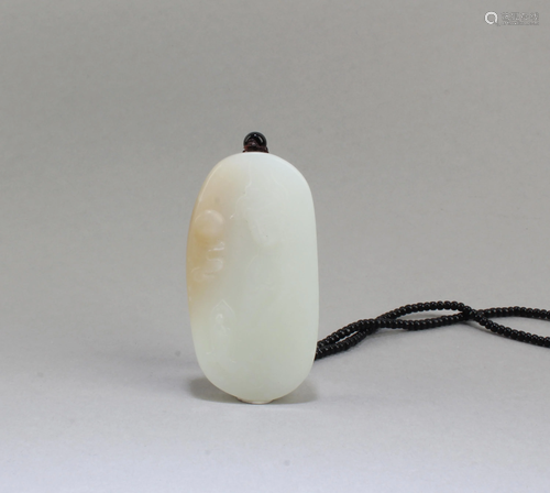 A Carved Jade Pendant with necklace