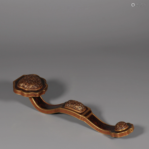 A Porcelain Ruyi Scepter, decorated with archaistic