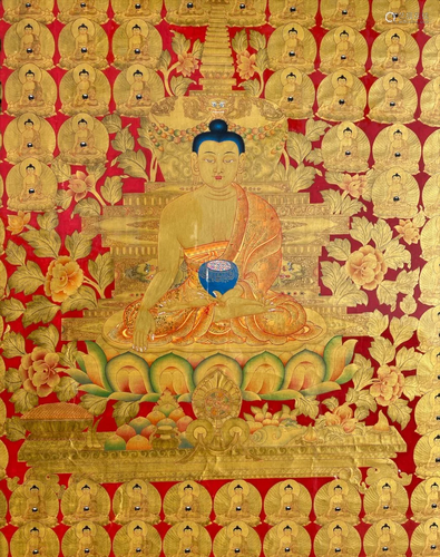 A Framed Red Ground Thangka