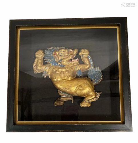 A Framed gilt copper RepoussÃ© snow lion, Tibet, circa