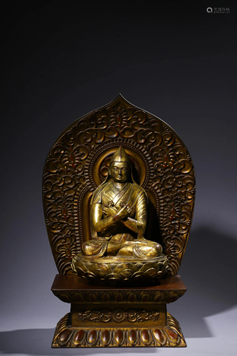 A Ming Styled Gilt bronze Buddha Statue with lotus