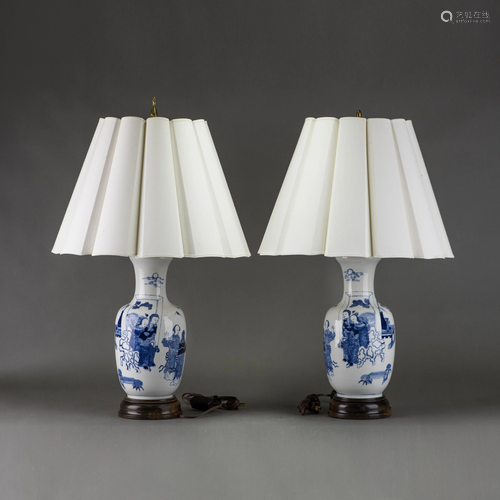 A PAIR OF BLUE AND WHITE 'FIGURAL' VASES, MOUNTED AS