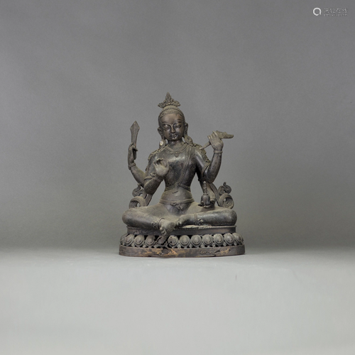 A BRONZE FIGURE OF GUANYIN