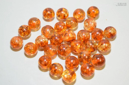 Group of Chinese Amber Carved Beads