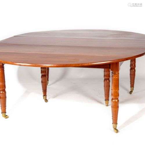 Grande table de salle à manger en acajou massif de forme cir...