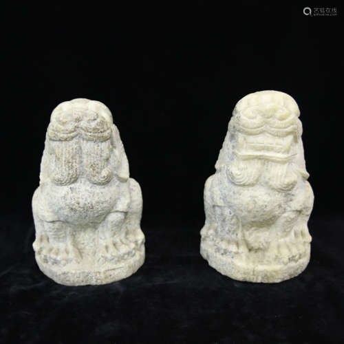 A pair of Ming style stone carved beasts