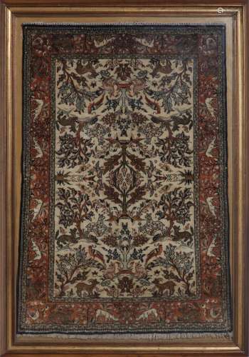 Arte Islamica A silk carpet decorated with animals and flora...