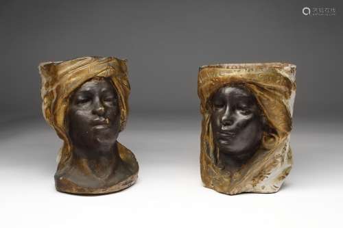 Arte Islamica A polychome earthenware Moor heads vases South...