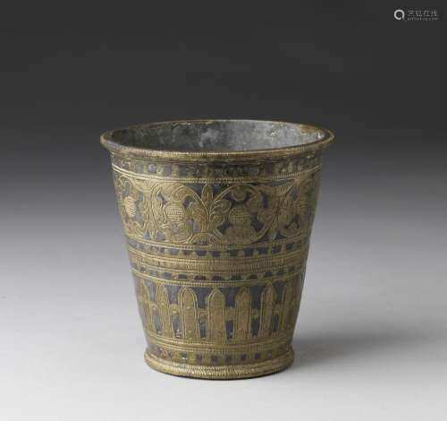 Arte Indiana A bronze nielloed cup decorated with floral eng...