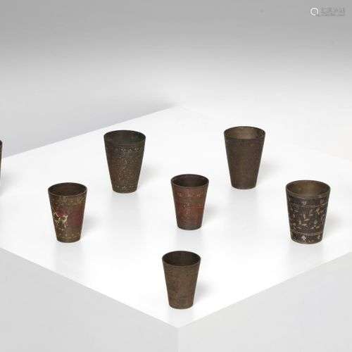 Arte Islamica A group of eight metal cups engraved with vege...