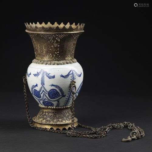 Arte Islamica A Kutahya blue and white pottery vase mounted ...