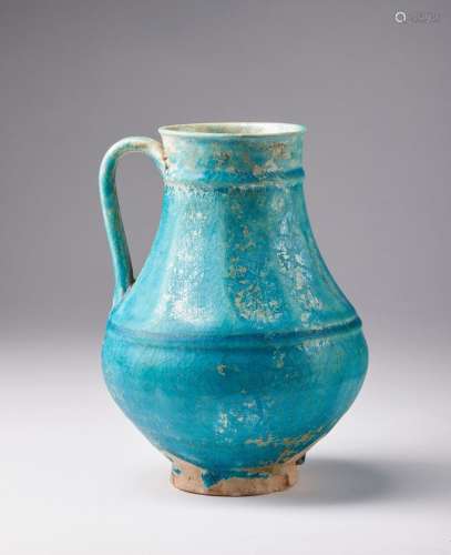 Arte Islamica A large Kashan turquoise glazed ewerIran, late...