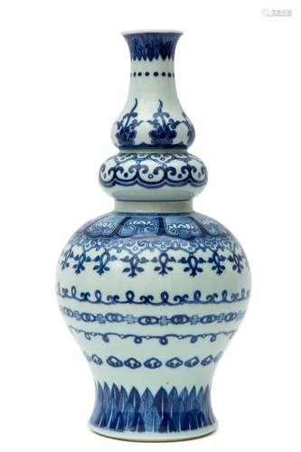 A blue and white triple gourd vase