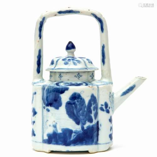 A blue and white arch-handled teapot