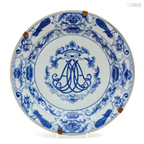 A large blue and white charger with crowned monogram