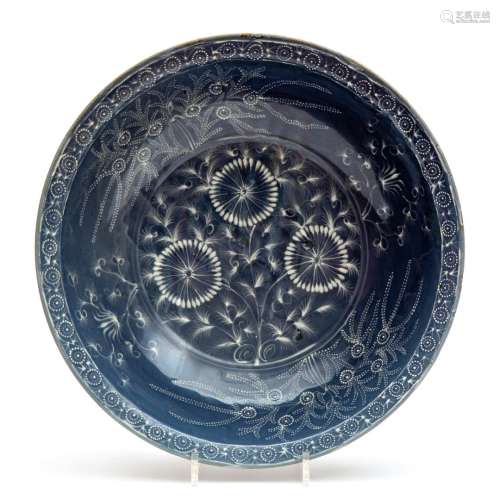 A large blue glaze Swatow dish with slip decoration