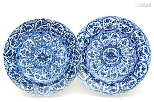 Two blue and white floral chargers