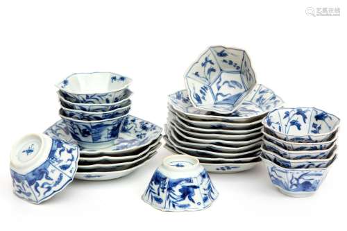 Twelve Blue and White Cups and Saucers