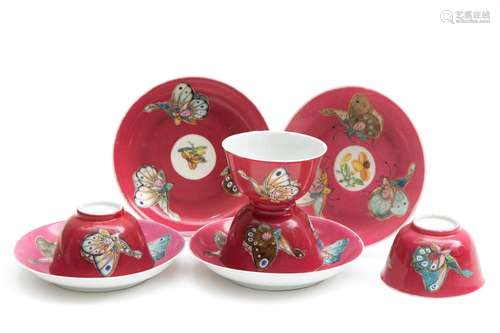 Four ruby ground tea bowls and saucers