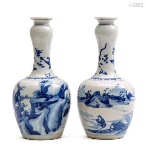A pair of blue and white garlic head vases