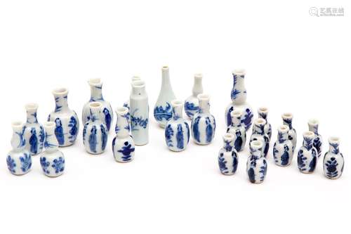 A collection of blue and white miniature dolls house vases