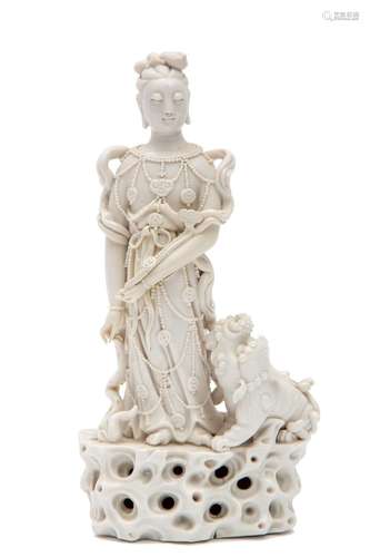 He Chaochun, a Blanc de Chine standing Guanyin with kylin